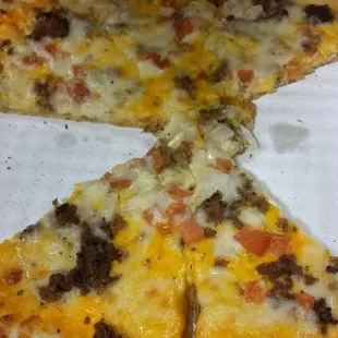 Tijuana Taco pizza that showed up luke warm and they forgot the lettuce and crushed tortilla chips...