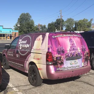 a purple van parked in a parking lot