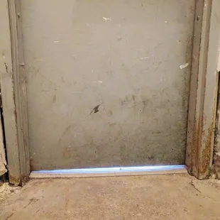 Badly damaged rear entrance of the Marleigh.