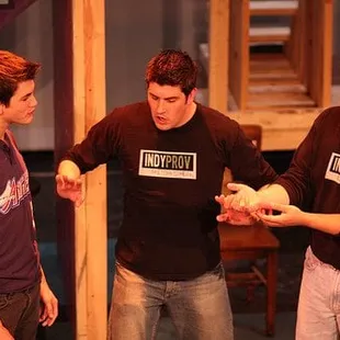 Memebers Bill Skaggs and Jerry Johnson play a game with an audience member.