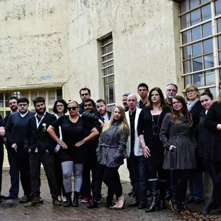 a group of people standing in front of a building