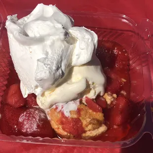 Strawberry shortcake with whipped cream and vanilla ice cream