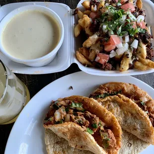 Chori fries, queso and Al pastor tacos