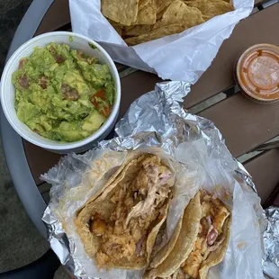 Chips &amp; guac, 2 fish tacos (grilled fish, chipotle slaw, rice), and their spicy salsa (great for heat lovers!)