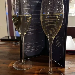 two glasses of wine on a table