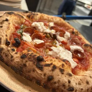 Can&apos;t stop thinking this pizza. The cheese islike the inside of a barrata. Plus cherry tomatoes, pepperoni and chilis. Highly recommend!