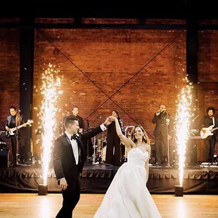 What better way to showcase your first dance than by starting it off with sparkler fountains!