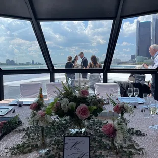 The bridal/groom party table and happy couple at the bow of Ovation Yacht!