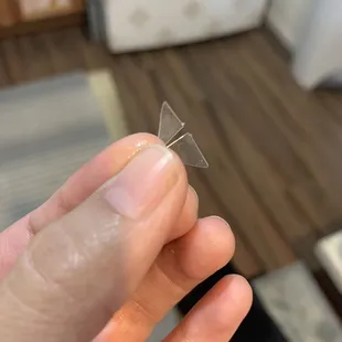 a person holding a piece of plastic