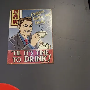 a man drinking a cup of coffee