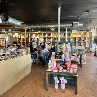 people in a cafe with a variety of items