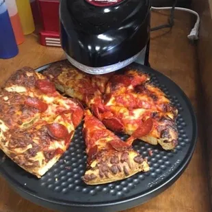 a slice of pizza on a plate