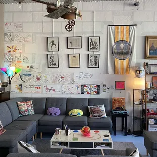 a living room filled with art
