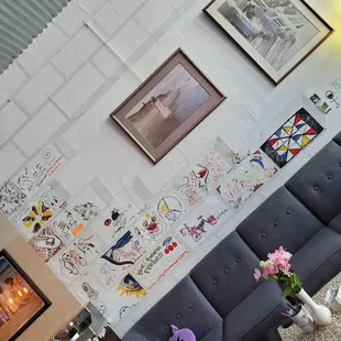 Artists that perform while in town are offered to leave their mark (and talent) on the wall.