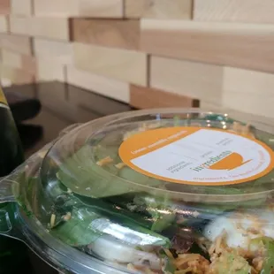 a salad and a bottle of beer