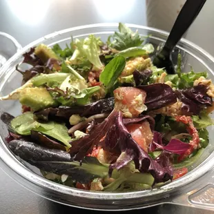 a salad in a bowl with a fork