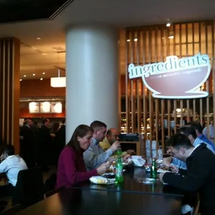 a group of people eating at a restaurant
