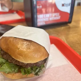 a hamburger wrapped in paper