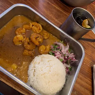 a tray of food with rice and shrimp