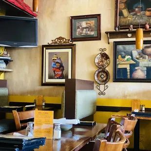 a dining area with tables and chairs