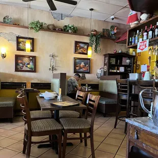 a man sitting at a table in a restaurant