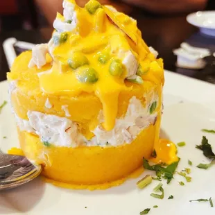 a plate of food with a spoon