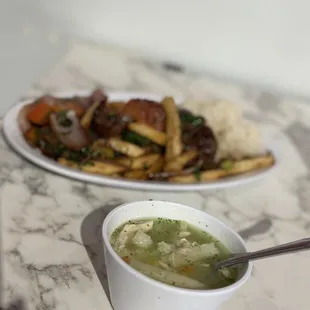 a plate of food and a bowl of soup