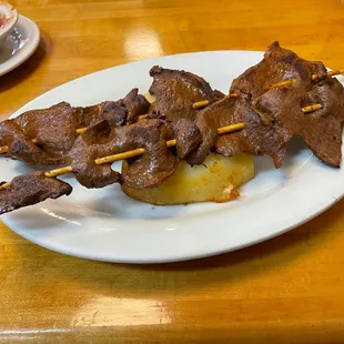 beef skewers on a plate