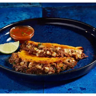 a plate of food on a blue table