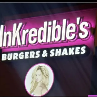 a neon sign for a burger restaurant