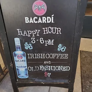 a sign for bacardi happy hour