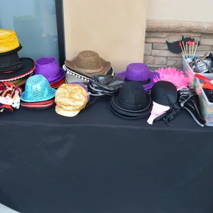 Large selection of props, including, hats, mask, crazy glasses and a large variety of boas. This picture doesn't do the selection justice.