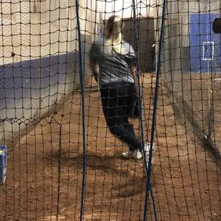 My daughter during her pitching lesson