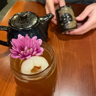 Lychee tea in the mason jar and hot jasmine tea in the pot