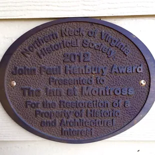 a plaque on the side of a building