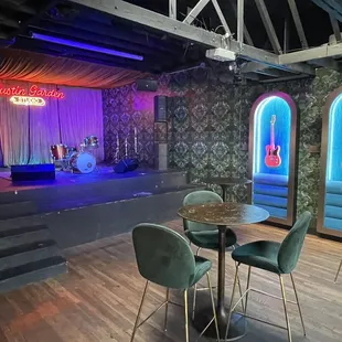 a stage with chairs and a table