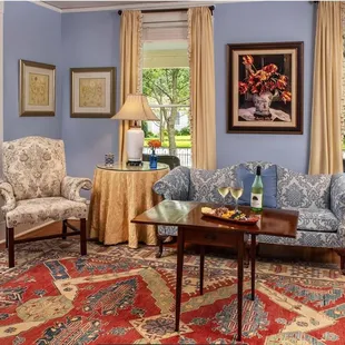 The Granville Queen Suite boasts a large separate sitting room, fireplace, jetted tub for two and web bar.