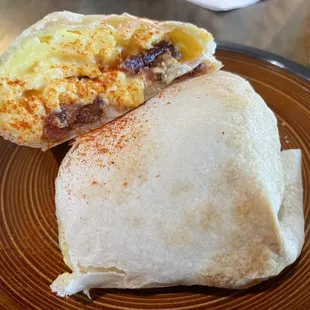 Egg bacon burrito, tasty and filling.