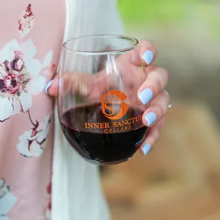 a woman holding a glass of wine