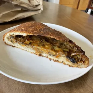 William's Empanada (filled with artichokes, parmesan, mushrooms, zucchini, and berbere) from the Little Sky Bakery stand