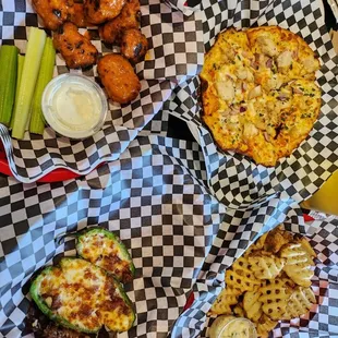 more food   waffle fries, buffalo pizza, wings and jalapeño poppers