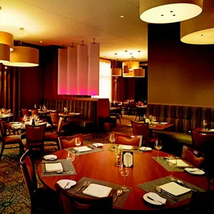 a circular table with place settings