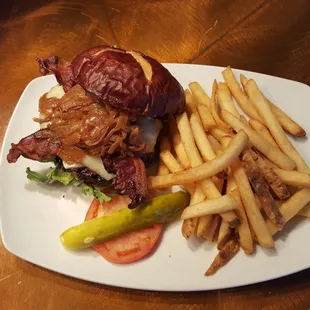 Crowne Burger-8oz burger with applewood bacon, caramelized onions, gruyere served on a pretzel bun
