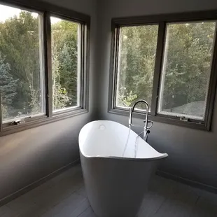 Full bathroom demolition with new windows, tub and tile. They had a bad mold and water issue.