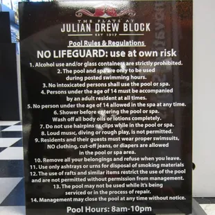 Pool rules sign for The Flats at Julian Drew Apartments.
