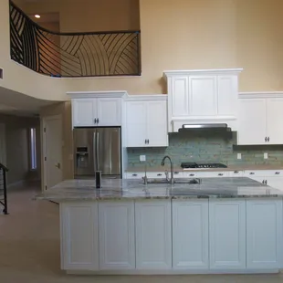 a kitchen with a marble counter top