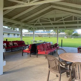 The pavilion in the grassy area, comfy couches &amp; clean tables