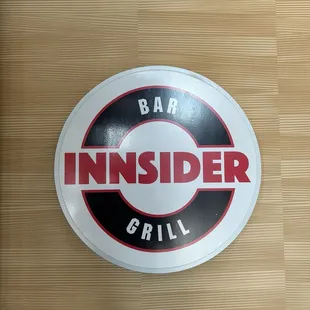 The logo on the wall