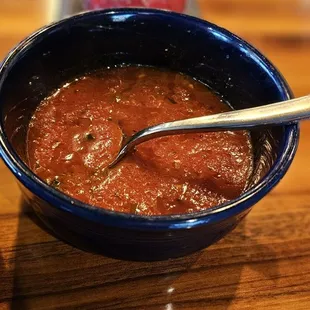 a bowl of soup with a spoon in it