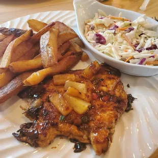 Jerk Chicken, hand cut fries and signature slaw.